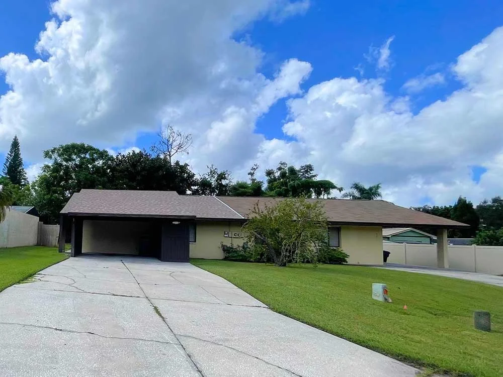 Ranch home with two carports on each side