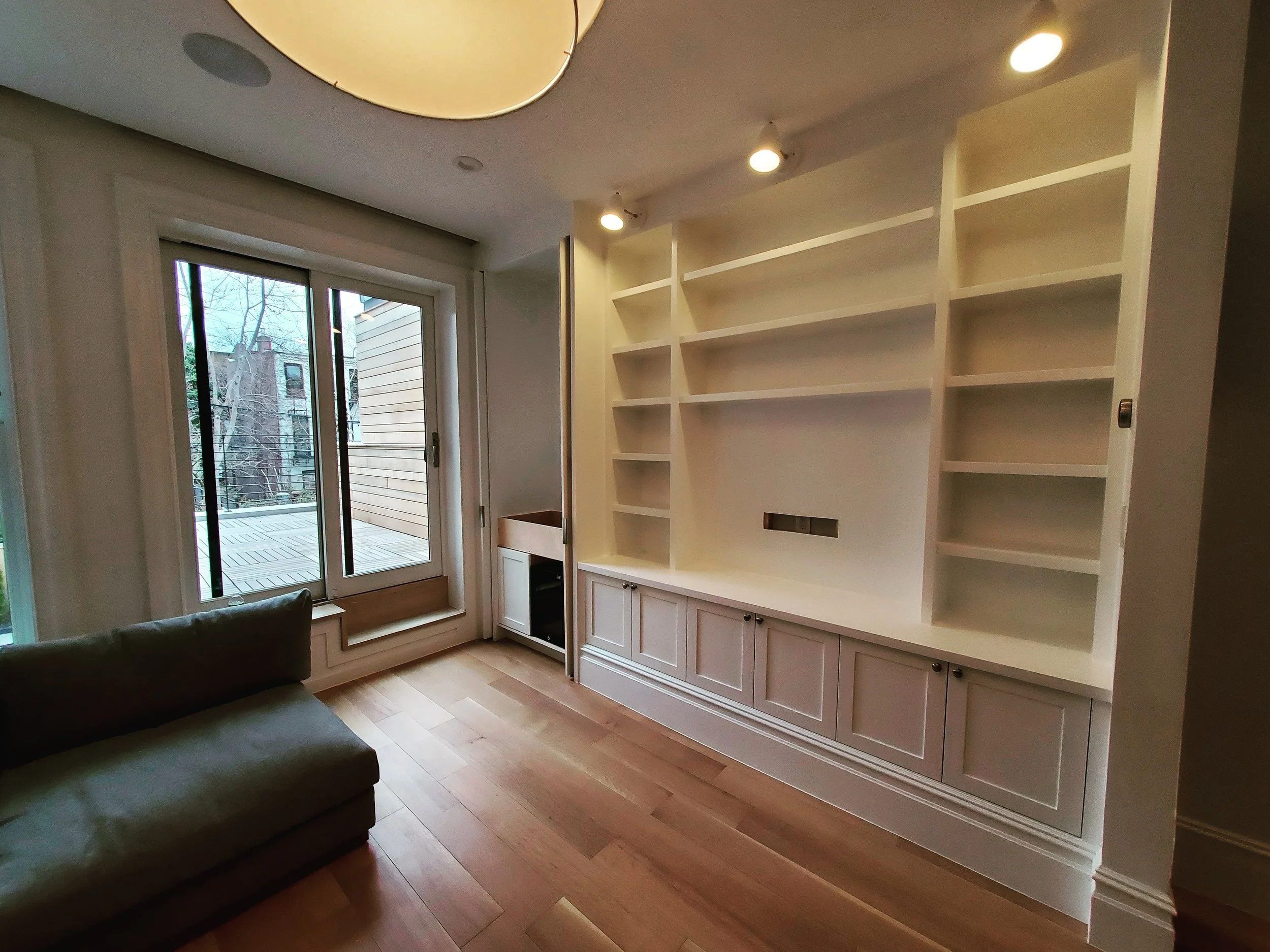 Built in entertainment center with a bar.