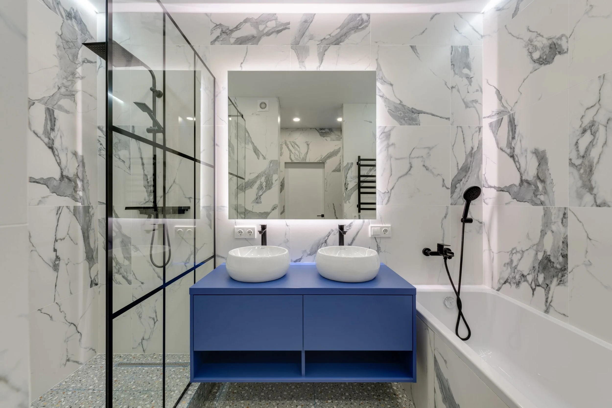 A blue vanity for a splash of color and continuity of design.