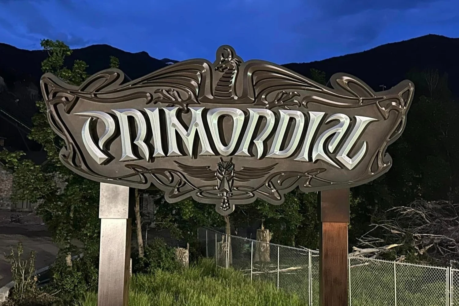 Ornate Primordial sign with decorative borders and dragon detail