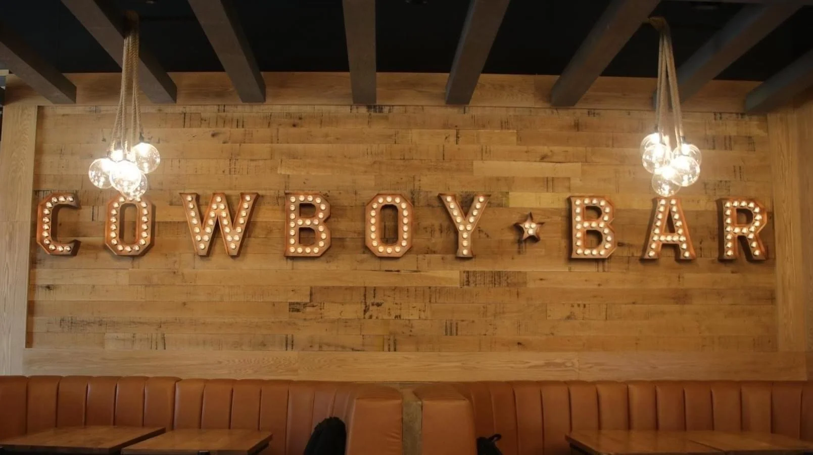 Illuminated Cowboy Bar channel letters fabricated by UFB Fabrication