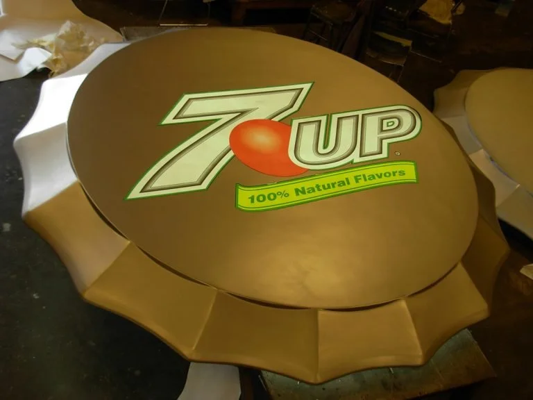 Custom round table featuring 7UP branding
