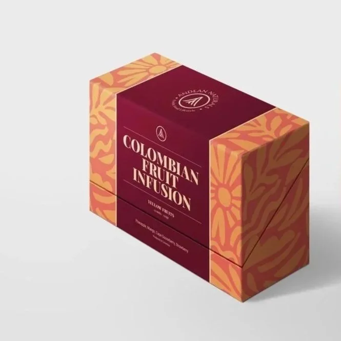 Box of Colombian fruit infusion with yellow fruits and orange leaf pattern design.