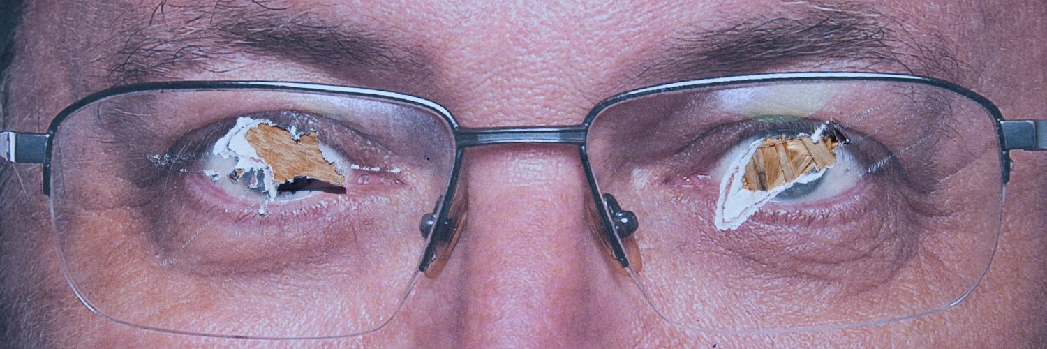 A photo of the eyes of a politician from their vandalized election campaign poster