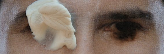A photo of the eyes of a politician from their vandalized election campaign poster