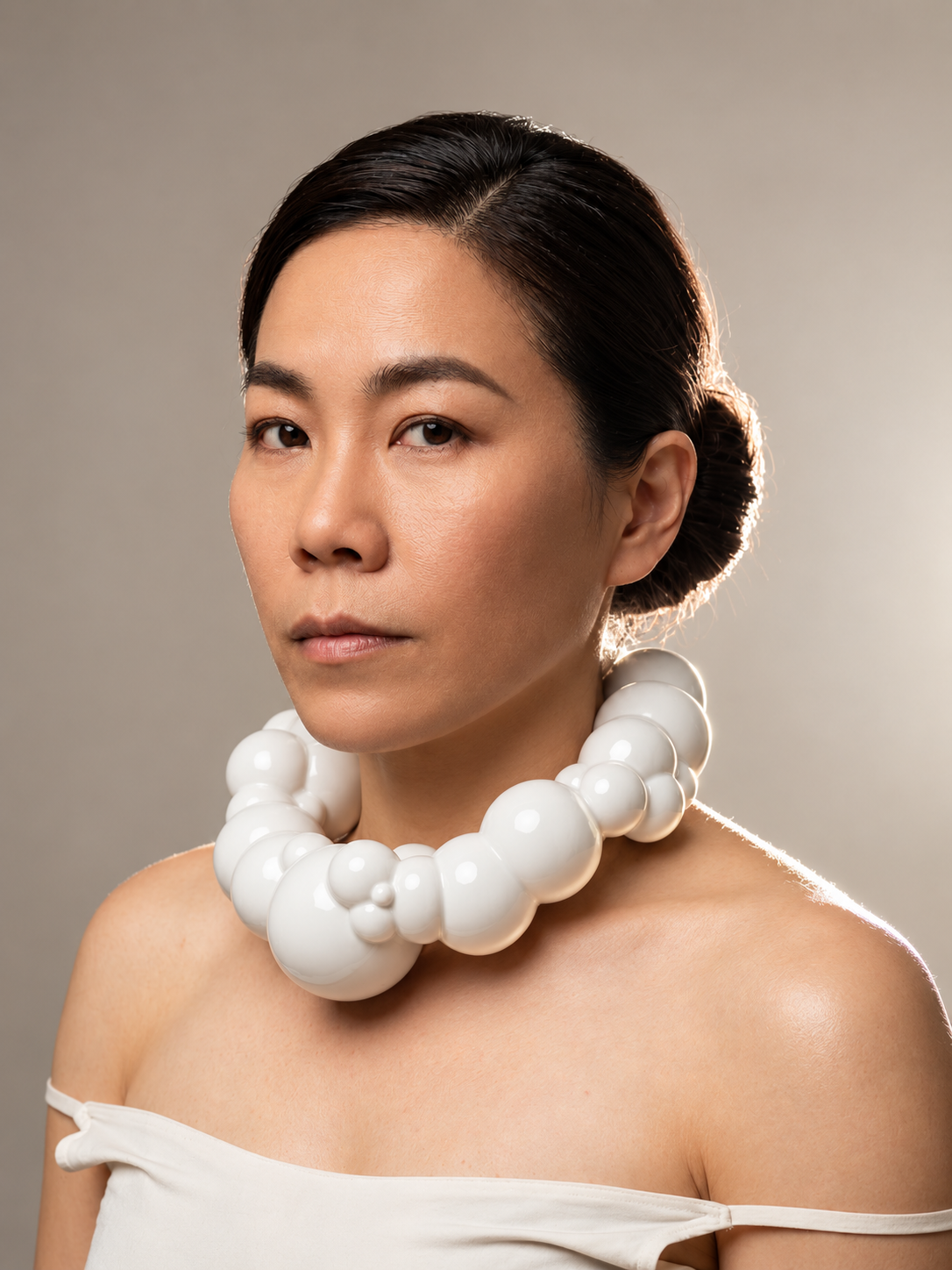 Sculptural Pearl Collar Portrait.png