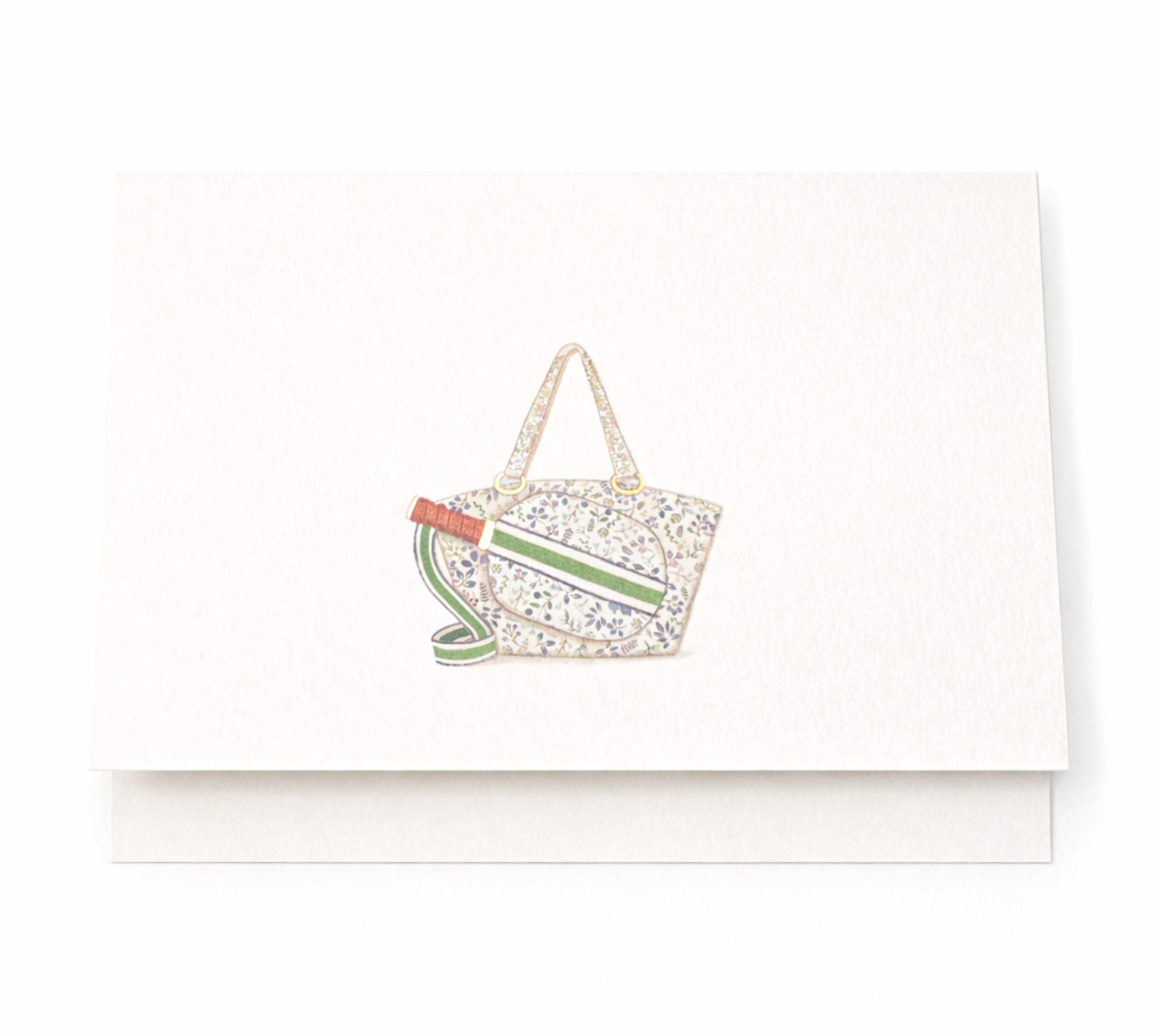 Pickleball themed notecard featuring floral sports bag and paddle with green strap detail