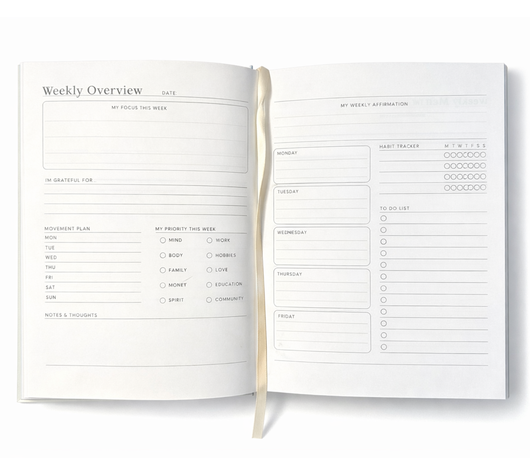 Open daily planner showing weekly overview pages with focus section, gratitude prompts, habit tracker, and to-do list.