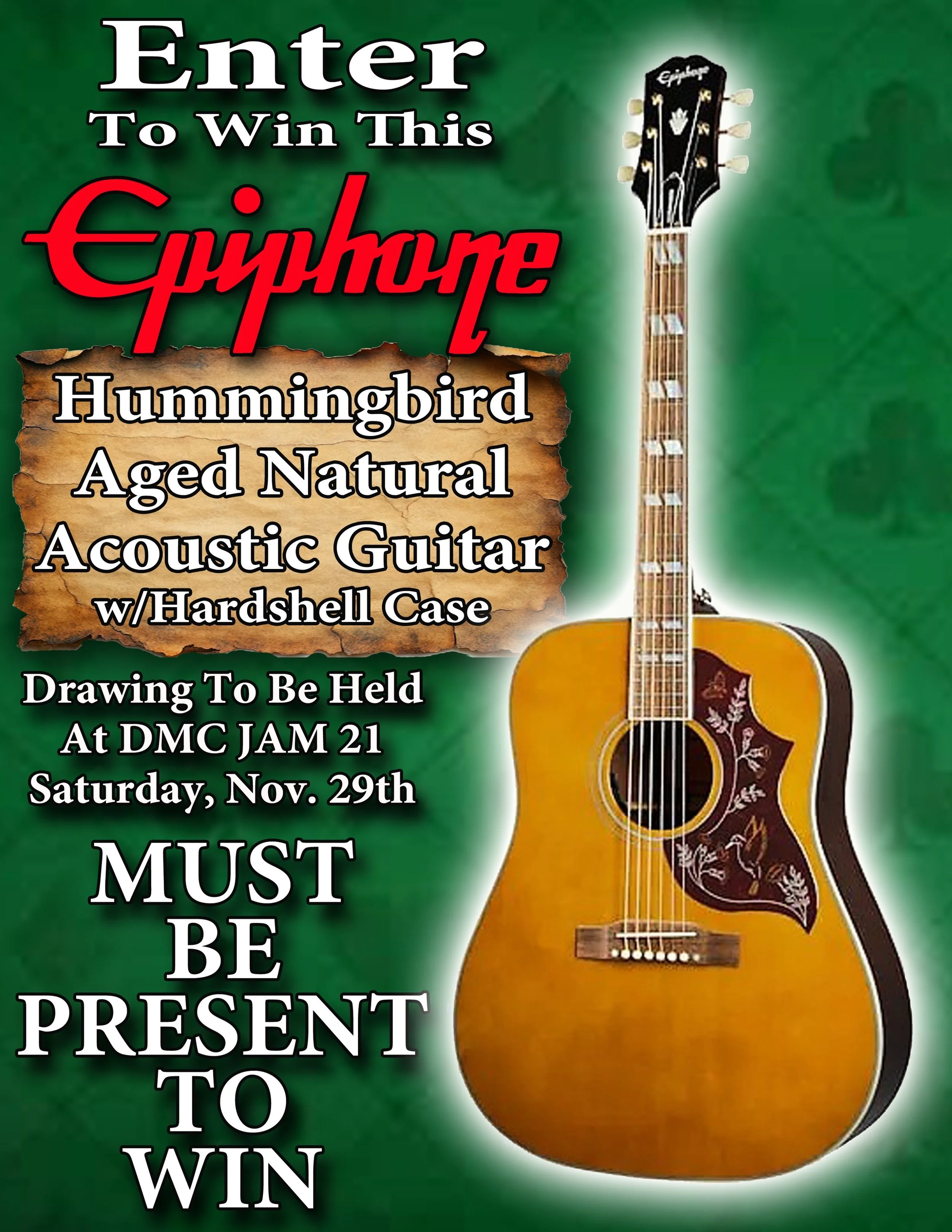Green poster promoting a contest with a photo of an aged natural acoustic guitar with a hardshell case. The poster states, 'Enter to win this Hummingbird Aged Natural Acoustic Guitar with Hardshell Case,' and mentions that drawing to be held at DMC Jam 21 on Saturday, Nov. 29th. It emphasizes that participants must be present to win.