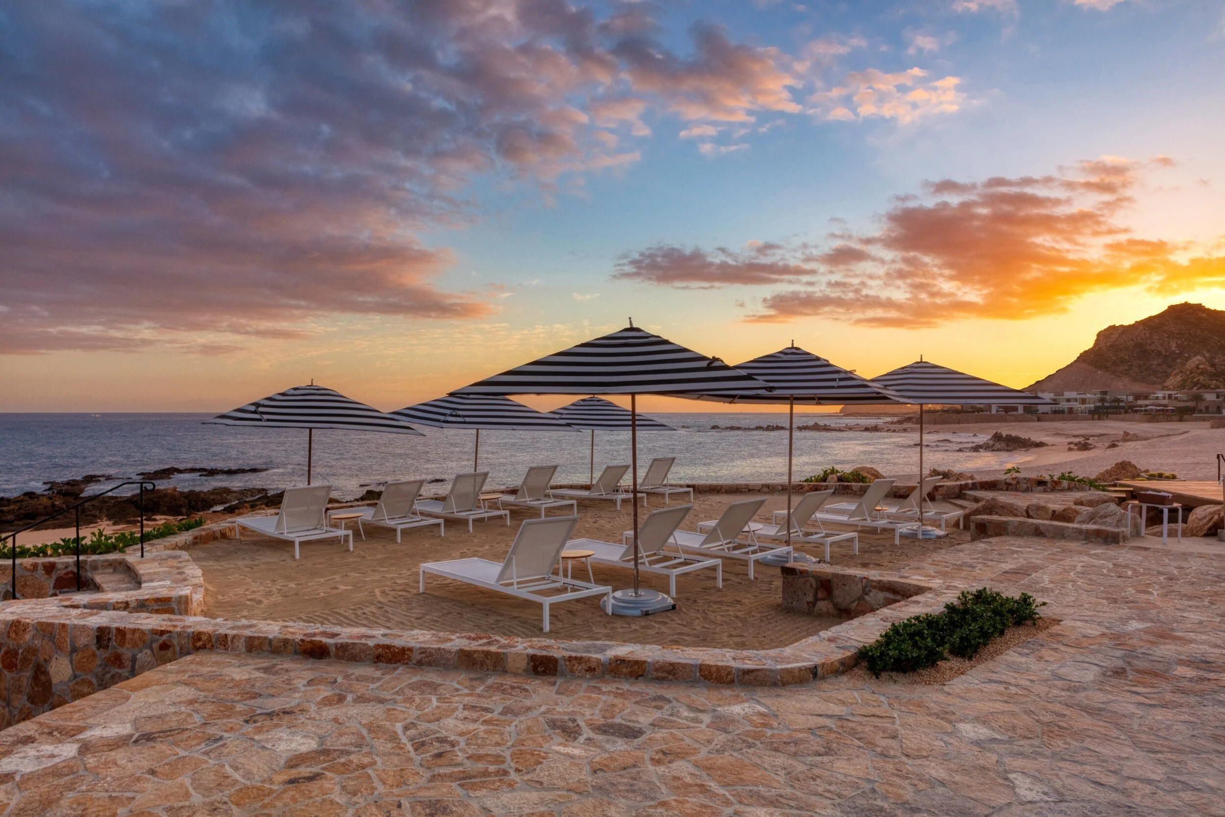 maravilla-los-cabos-beach-club-sunset-striped-umbrellas.jpg