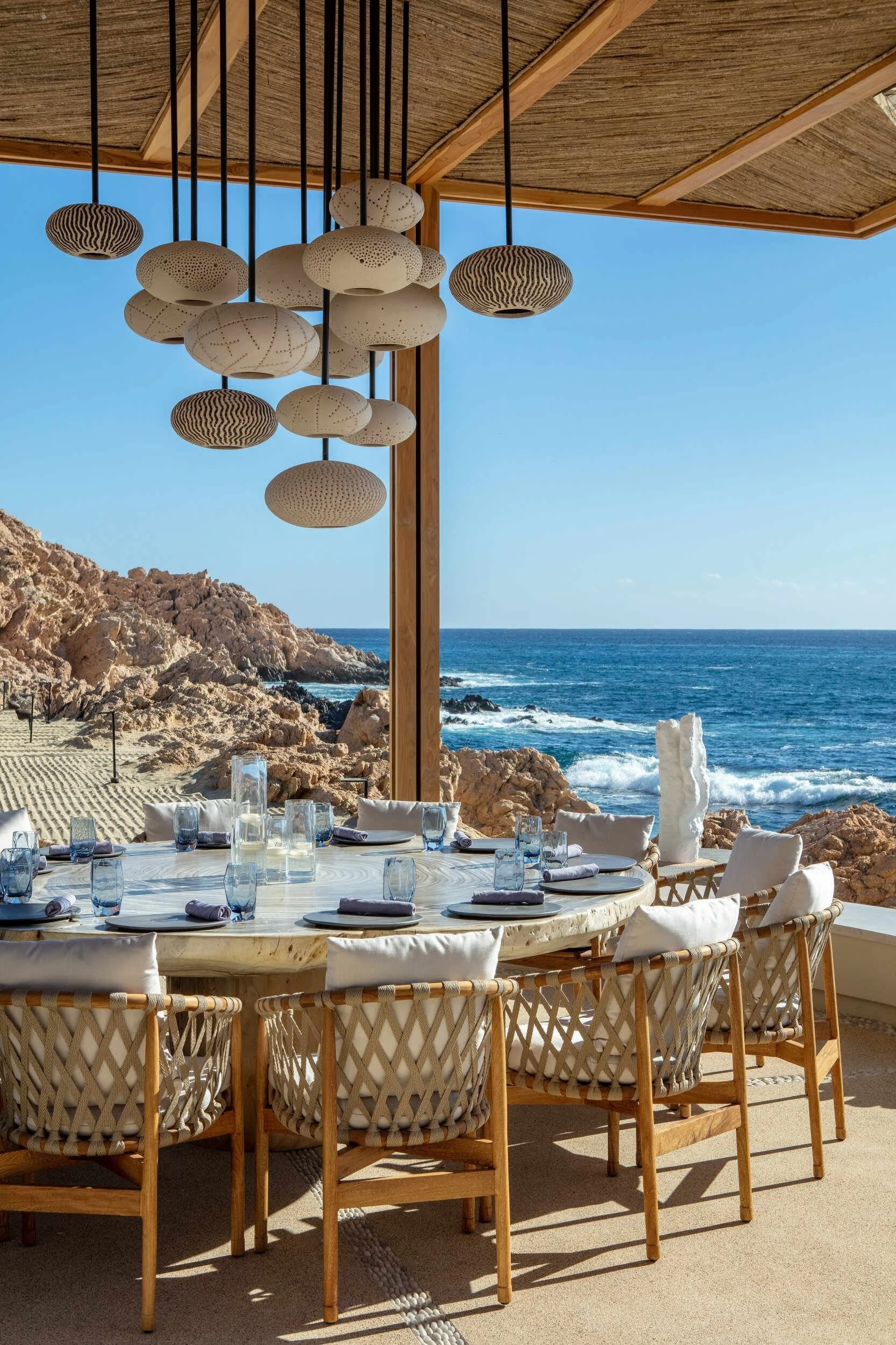 maravilla-los-cabos-outdoor-dining-table-woven-chairs-ocean.jpg