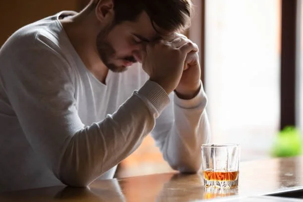 A dejected man willing to get rid of alcohol addiction