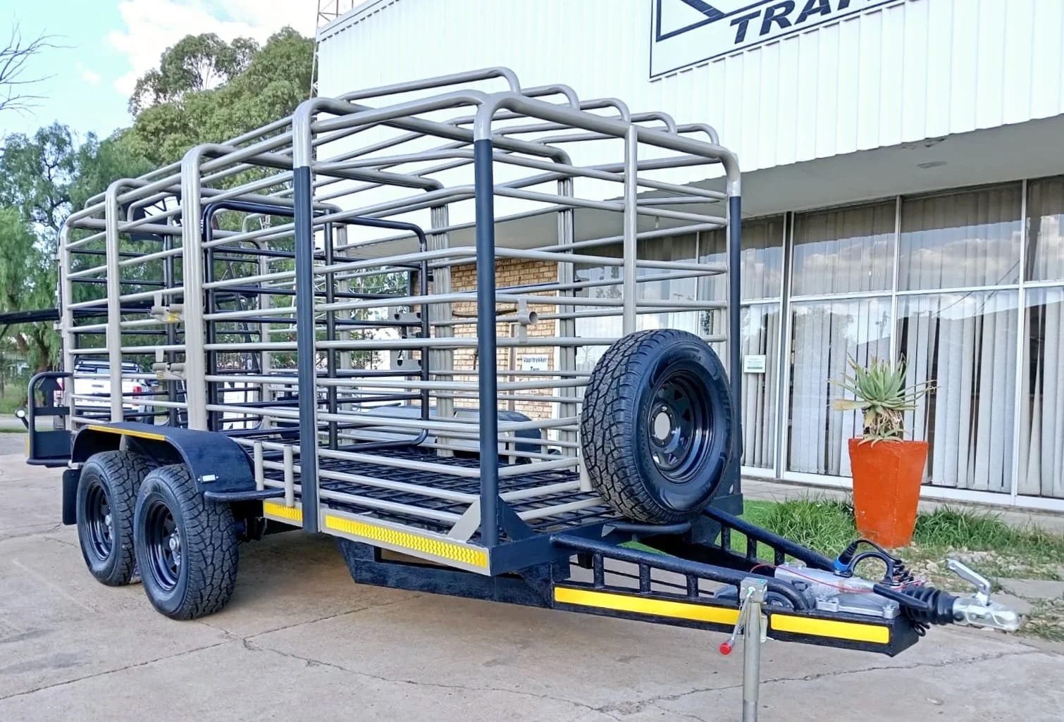 Livestock trailer with metal bars and spare tire