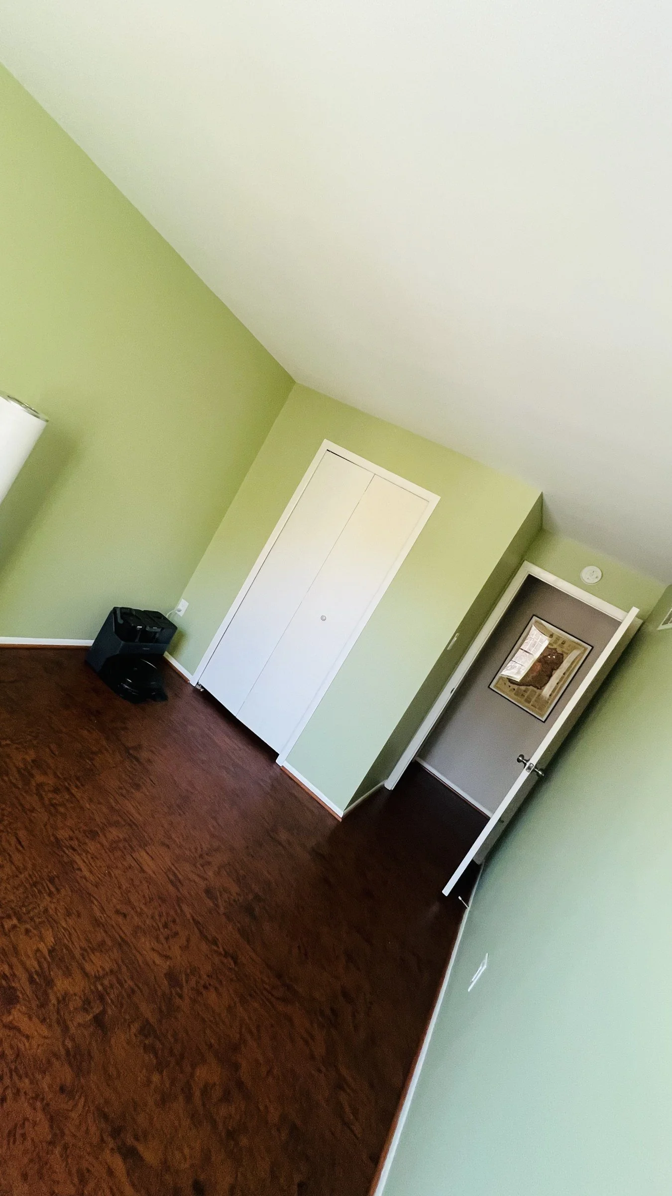 Finished Columbia bedroom with fresh light green walls and white trim