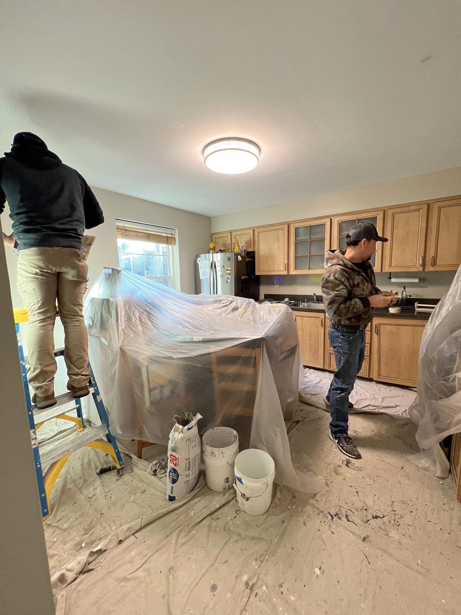 Furniture and kitchen surfaces protected during a Columbia interior painting project