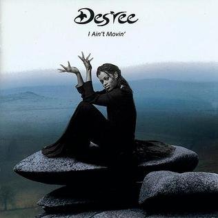 I Ain't Movin' - Des'ree album cover. Des'ree sits on a large flat rock.