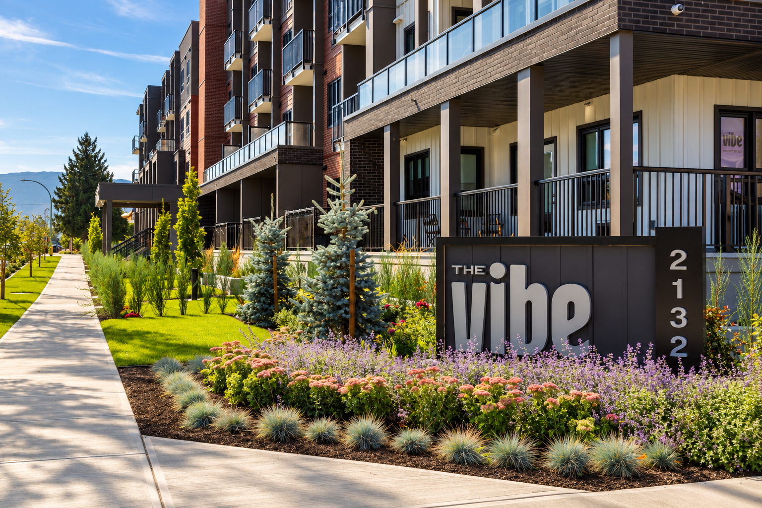Modern Condo Entrance with Lush Landscaping.png