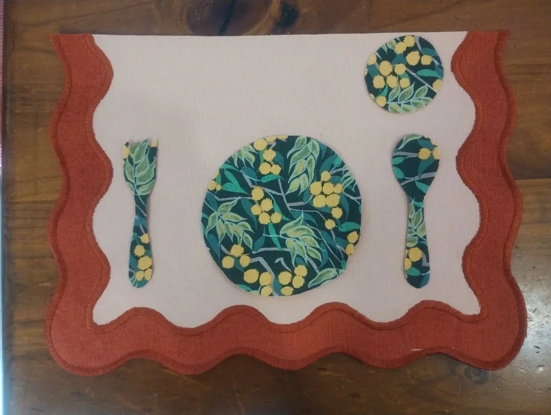 I've been working on placemats for my outdoor toddler environment. I love the colour scheme; it's deliberate and relevant to where we are situated. I toyed with the idea of buying silicone placemats I saw online but concluded that making them myself 