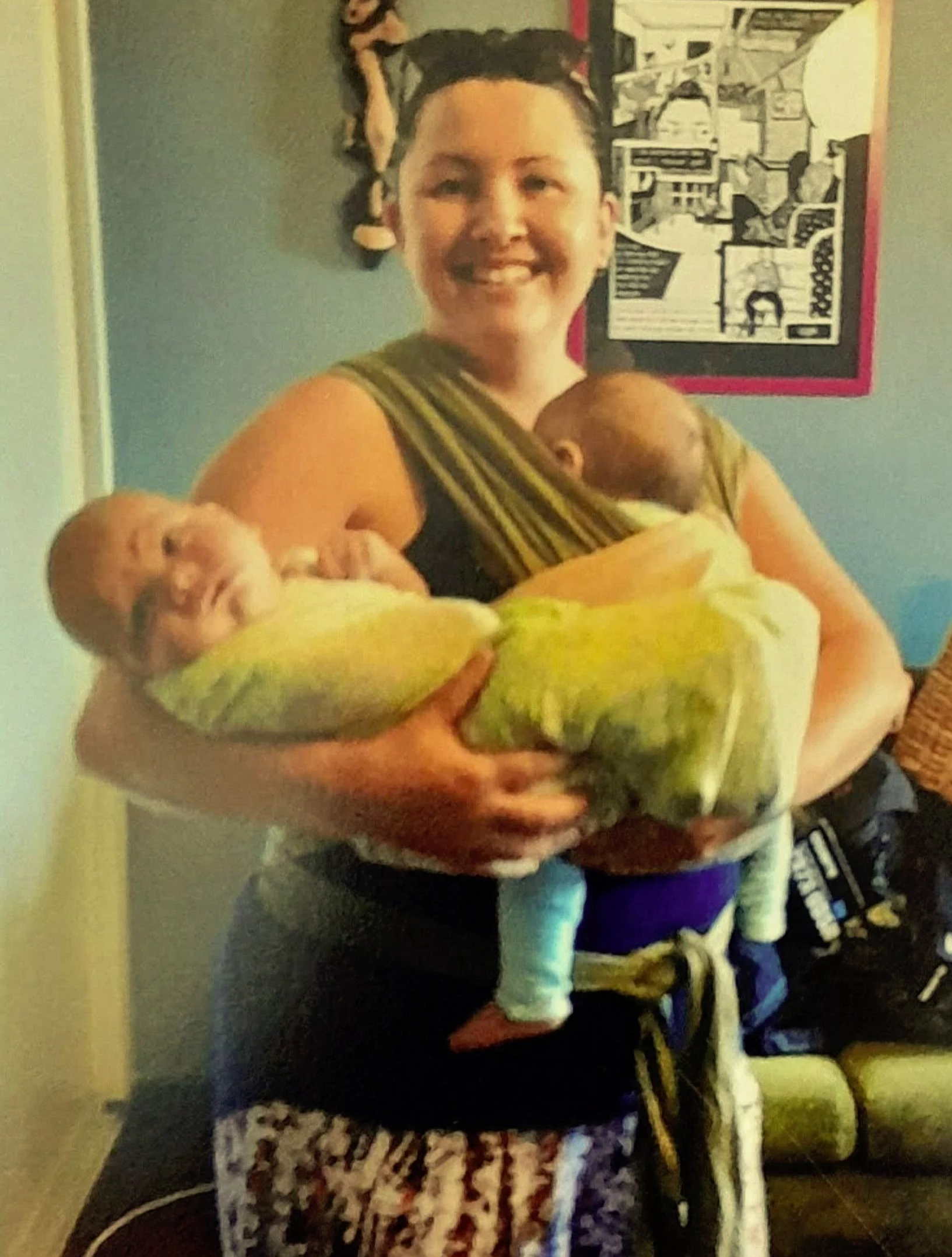 amber de vogt montessori teacher in noosa holding two babies