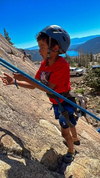 young boy rock climbing.jpg