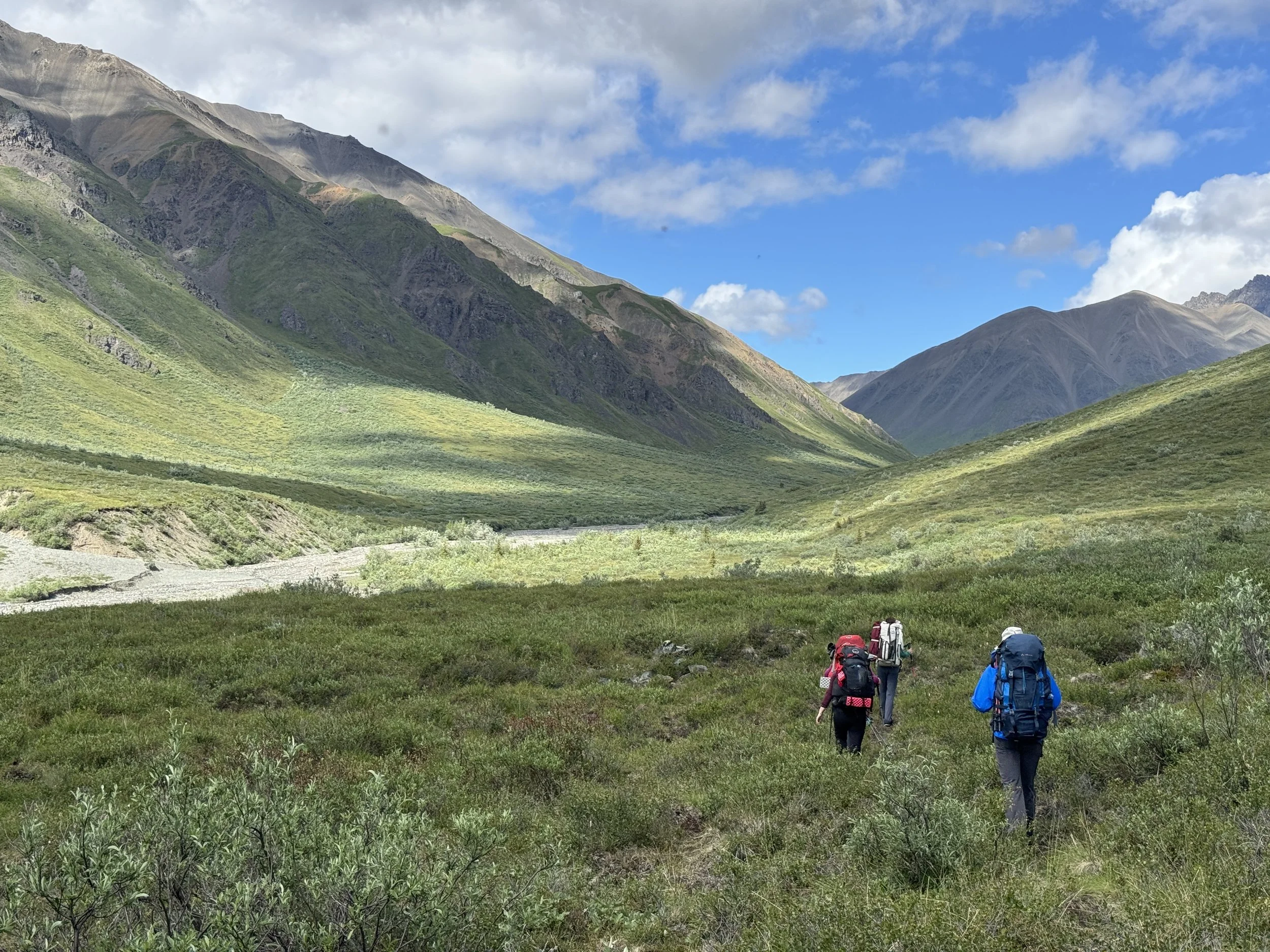 Backpackers travel in the Trail Creek drainage, Wrangell St. Elias National Park