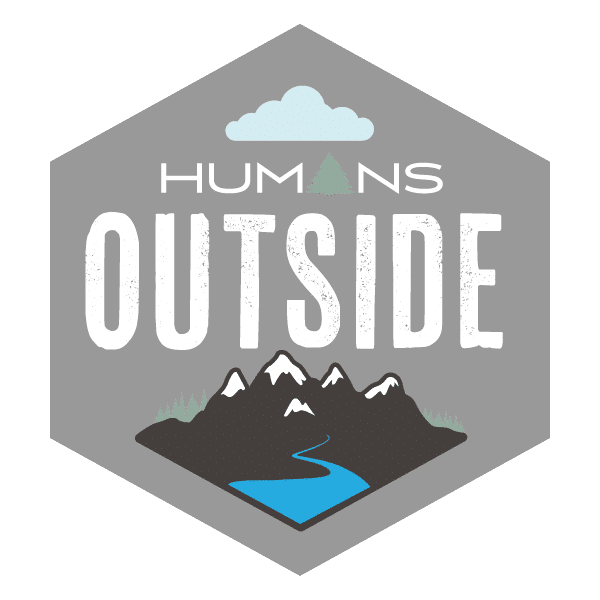 Logo with the words 'Humans Outside' featuring a cloud, mountain, tree, and river design.