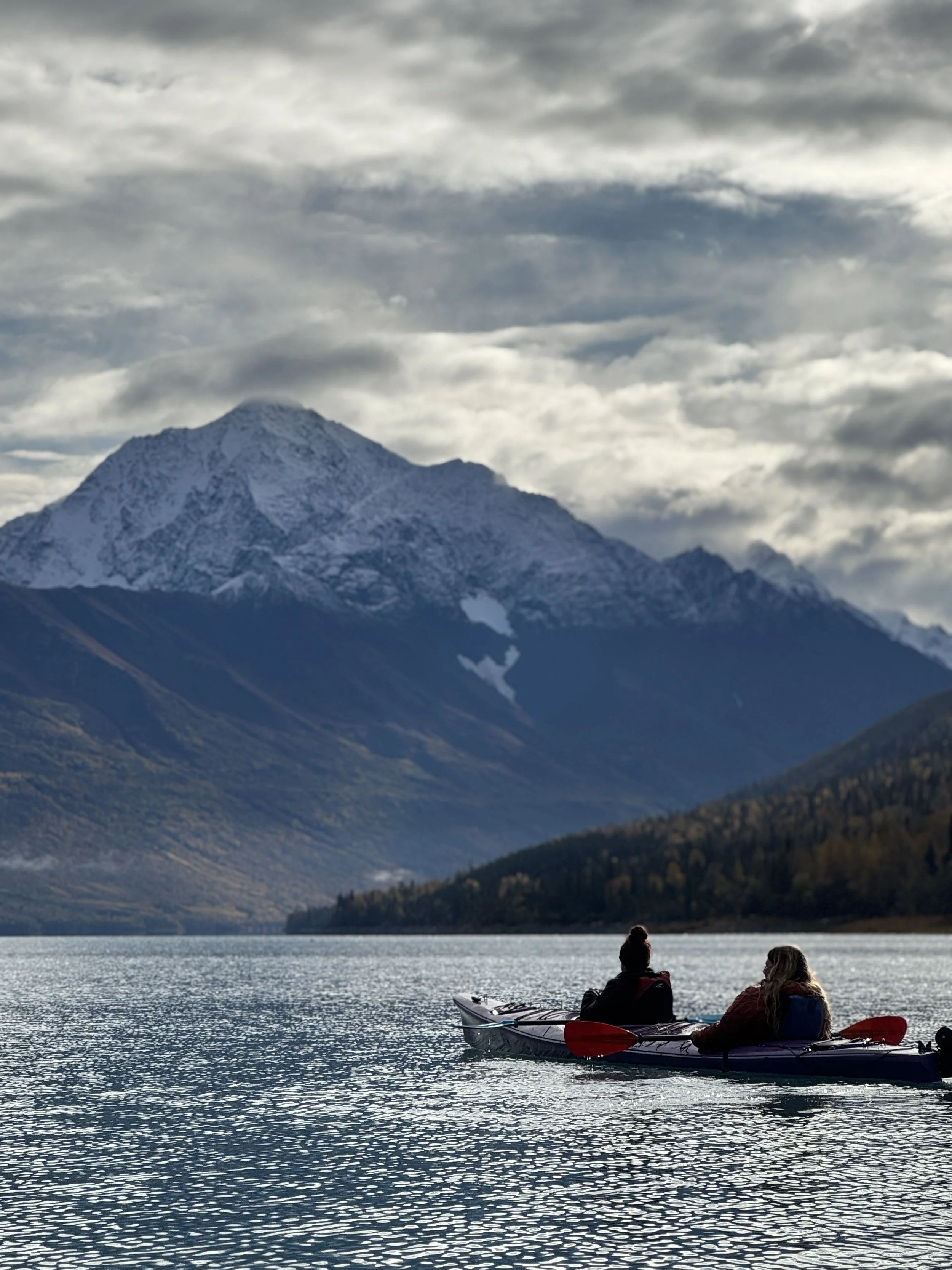 Kayakers on Eklutna Lake in Chugach State Park, Blod Peak in the background