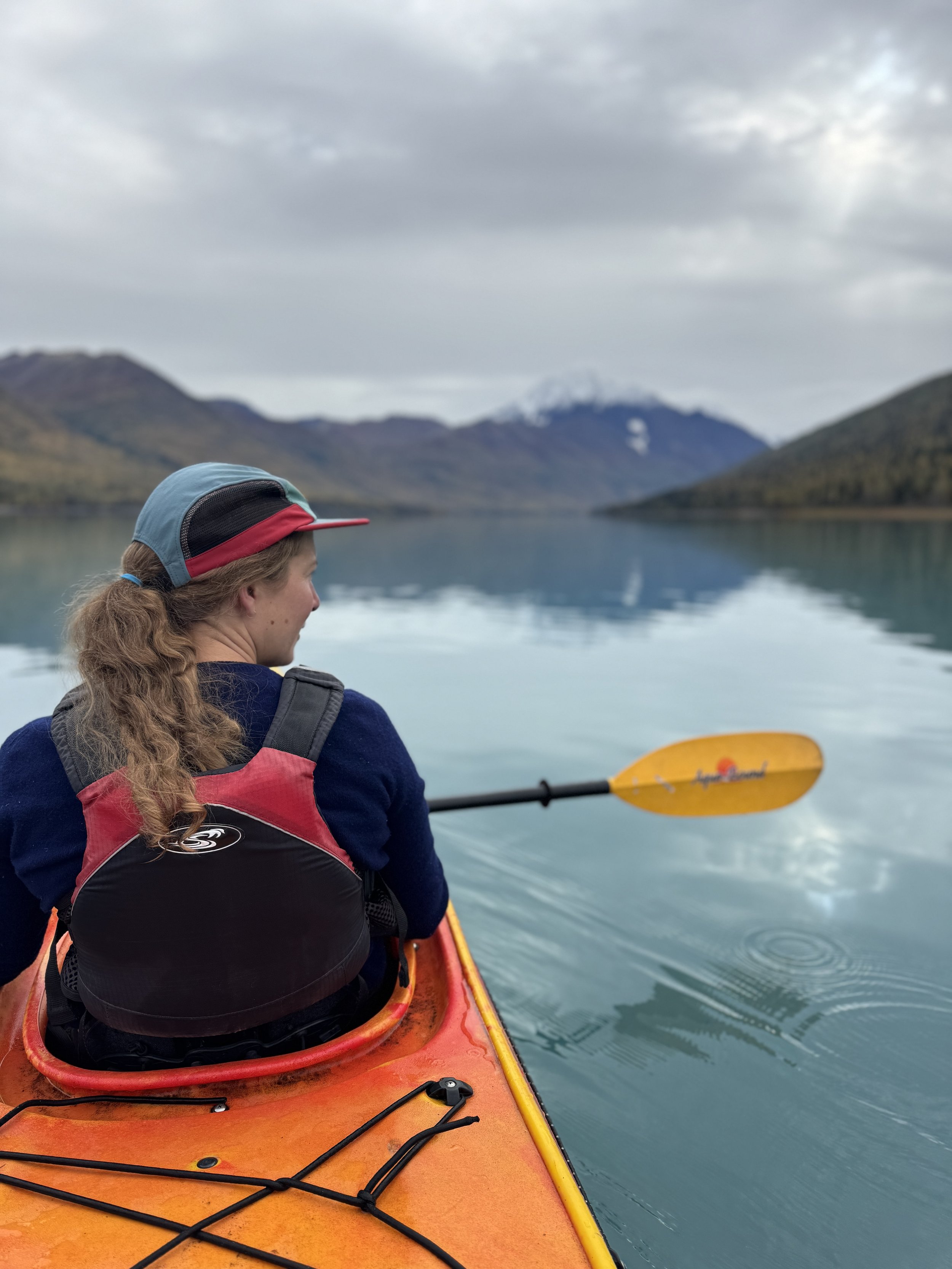 Kayaker on Eklutna Lake in Chugach State Park, Blod Peak in the background