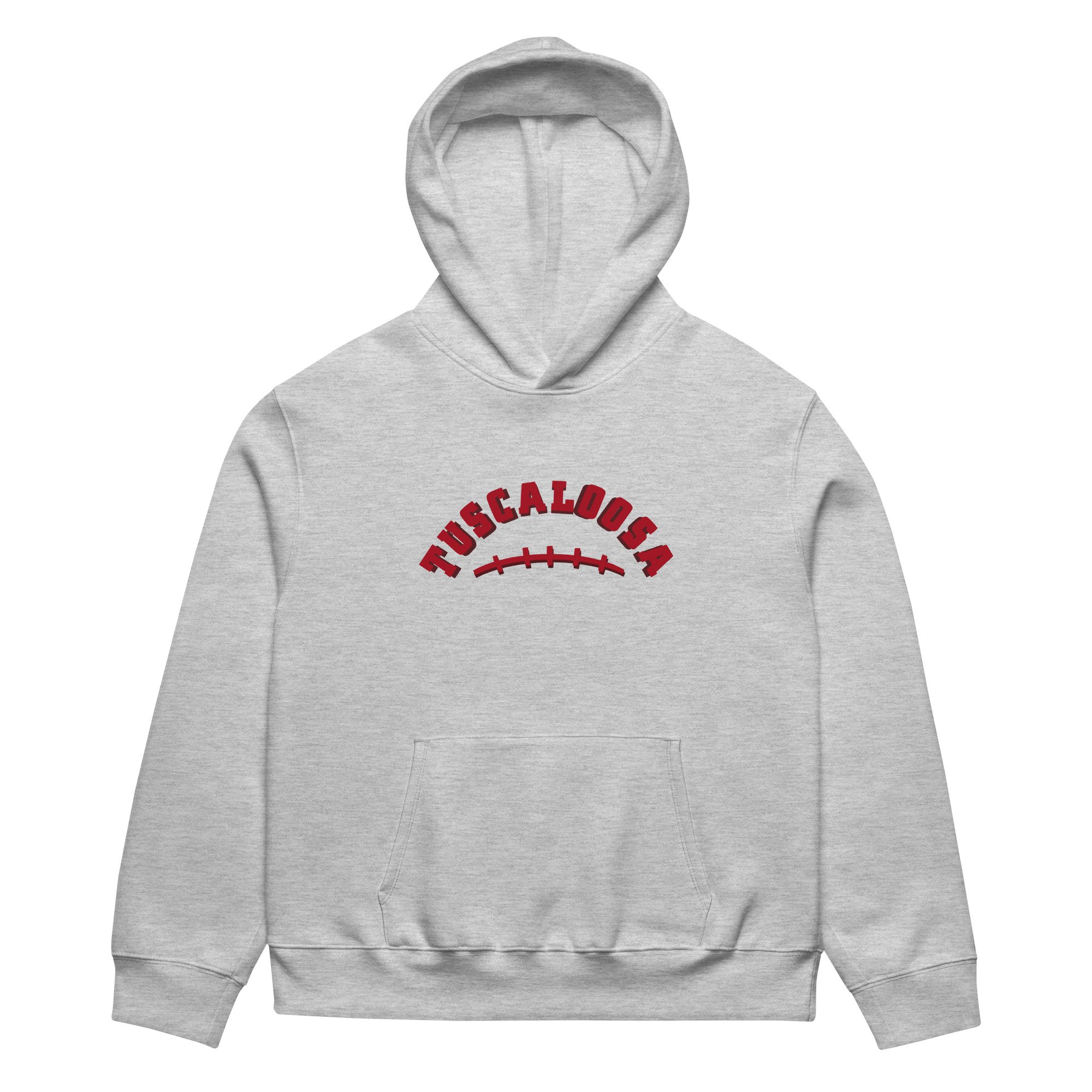 Heather grey hoodie with arched Tuscaloosa text and football stitch graphic. Oversized heavyweight fleece inspired by Alabama game days.