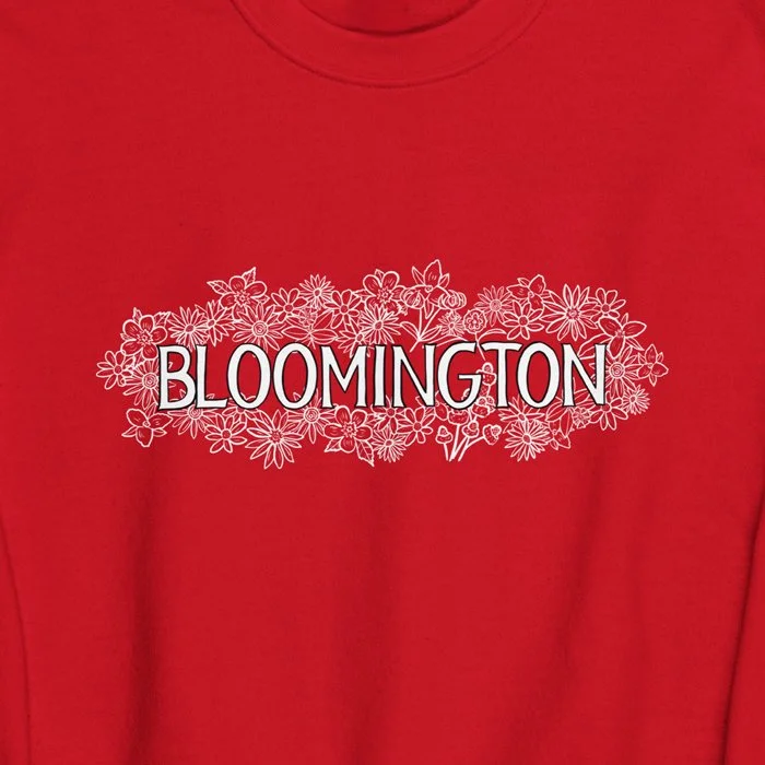 Close-up of white floral Bloomington text on red crewneck, inspired by IU’s campus style.