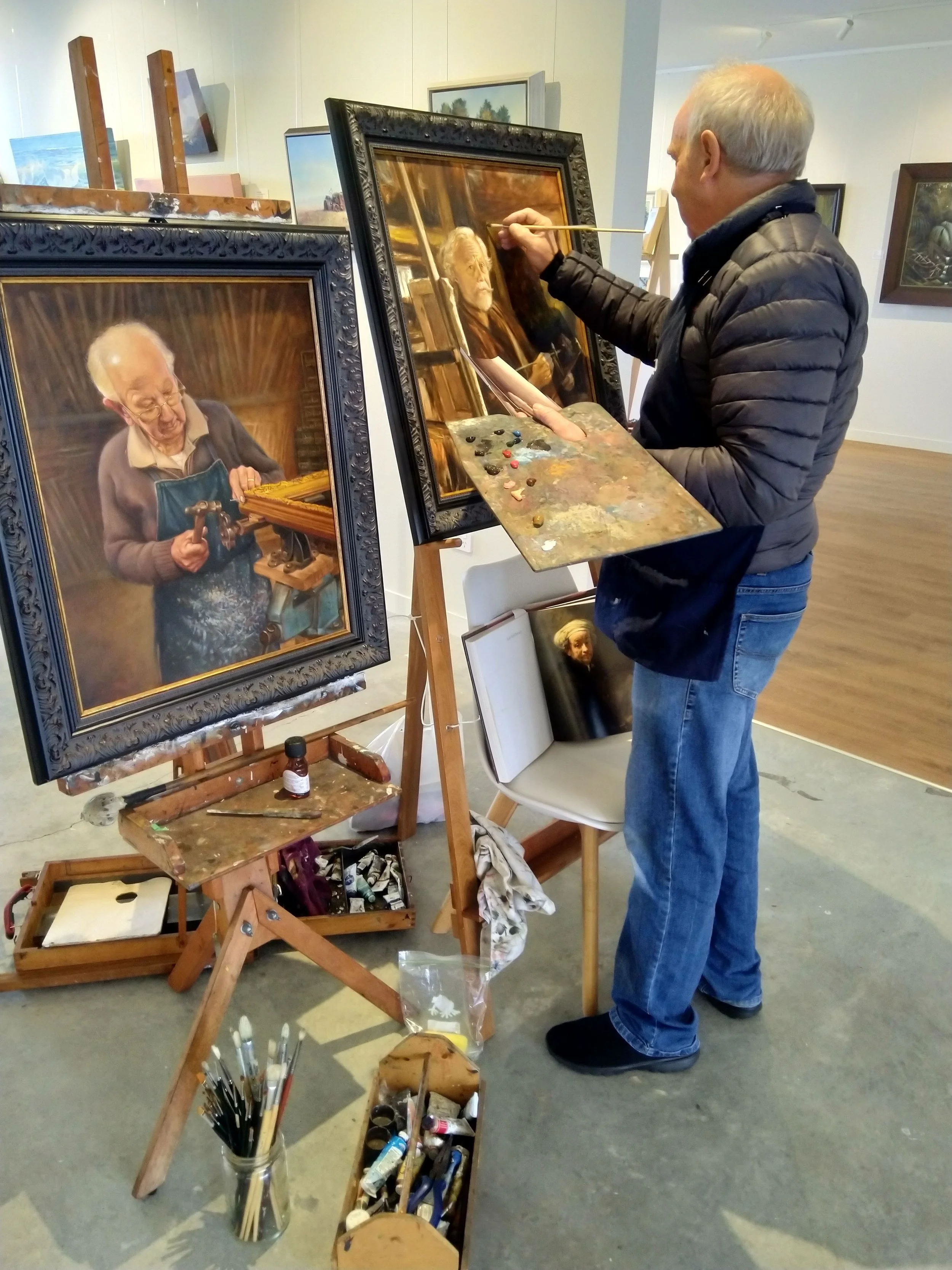 Photograph of artist Phillip Waddington giving a painting demonstration.jpg