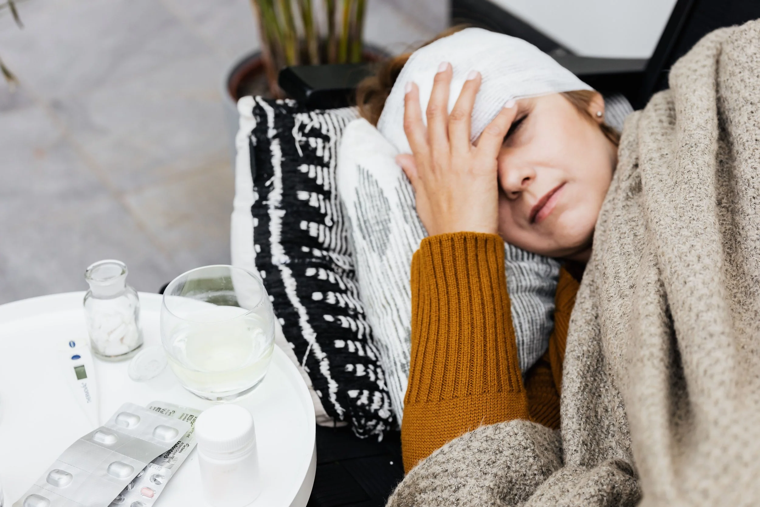 Woman holding head in pain
