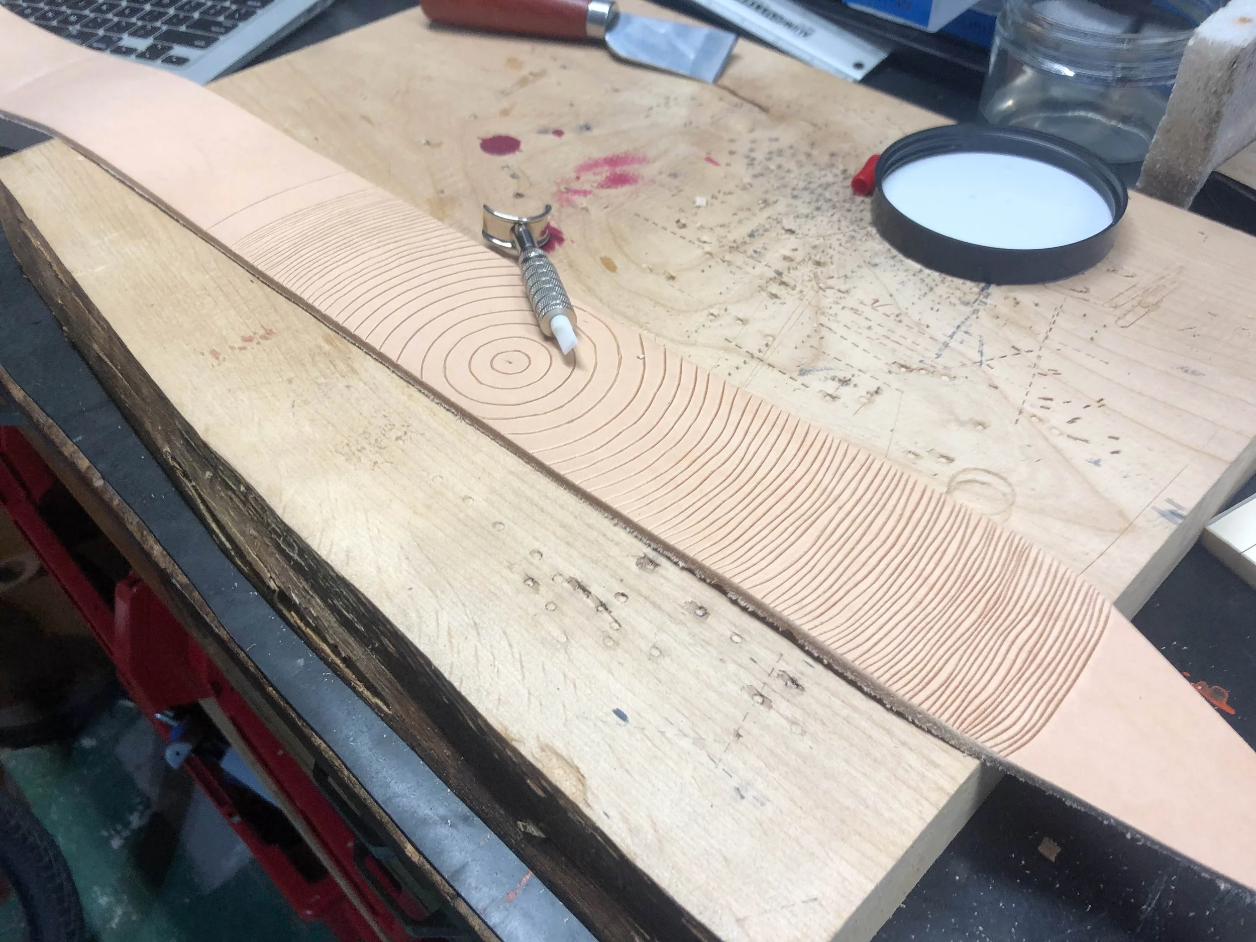 carving the lines with a swivel knife