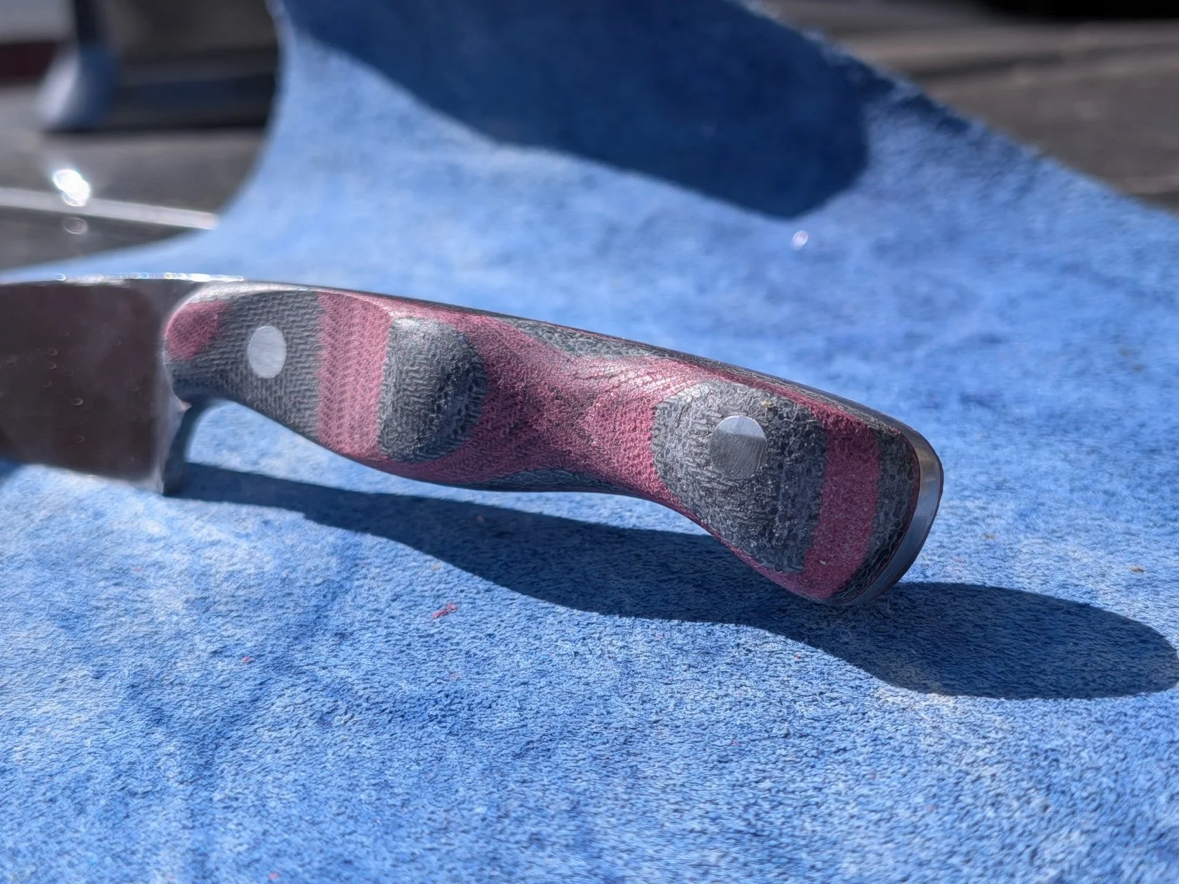 A knife made by a friend over a weekend visit, highlighting the home-made micarta handle