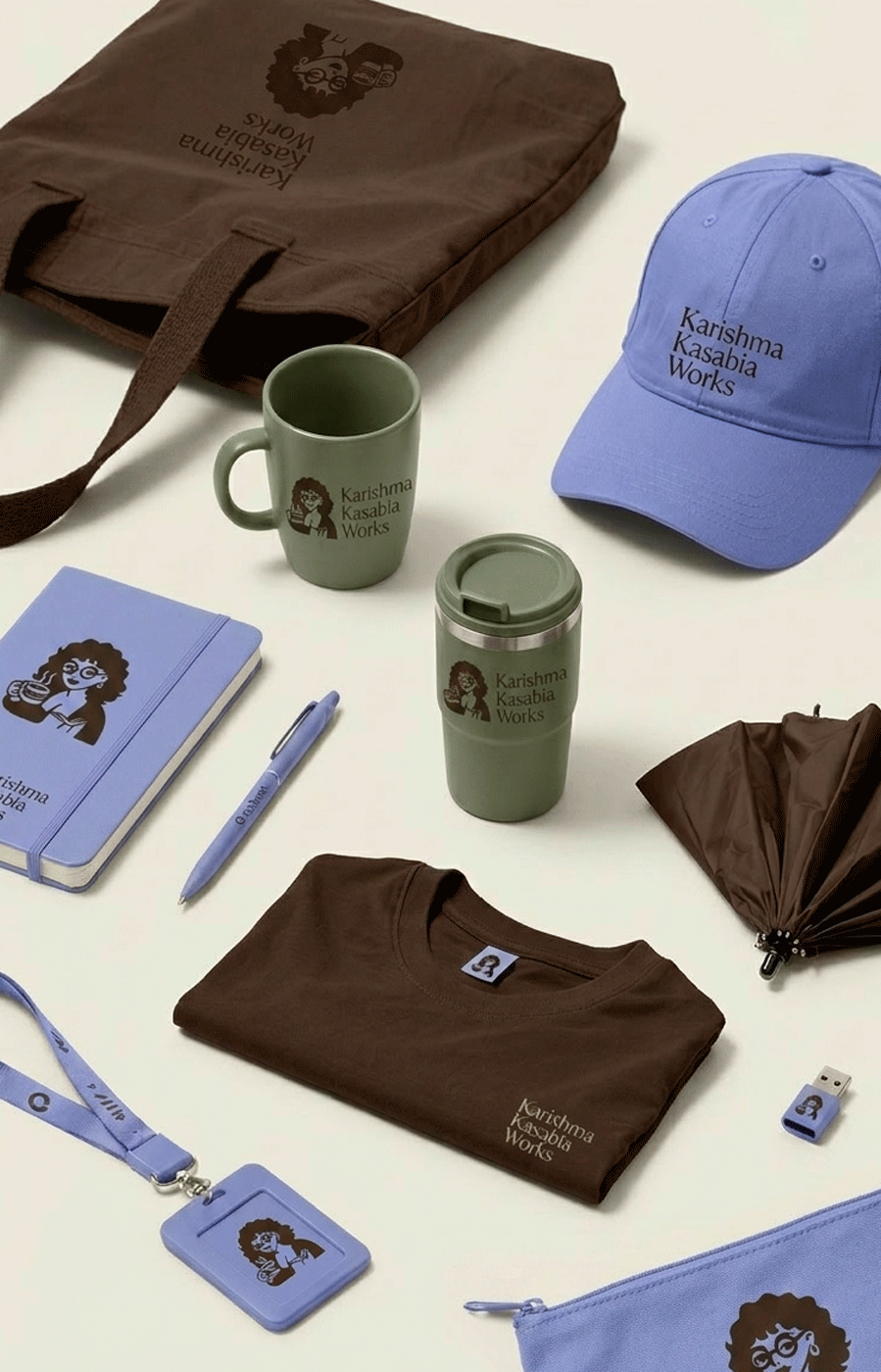 Upside down brown bag, blue cap, green mug, green travel mug, blue notebook and pen, brown T-shirt, blue lanyard and badge, blue zippered pouch, small brown umbrella, two green cups, and small blue item with logo, all with 'Karishma Kasabia Works' branding.