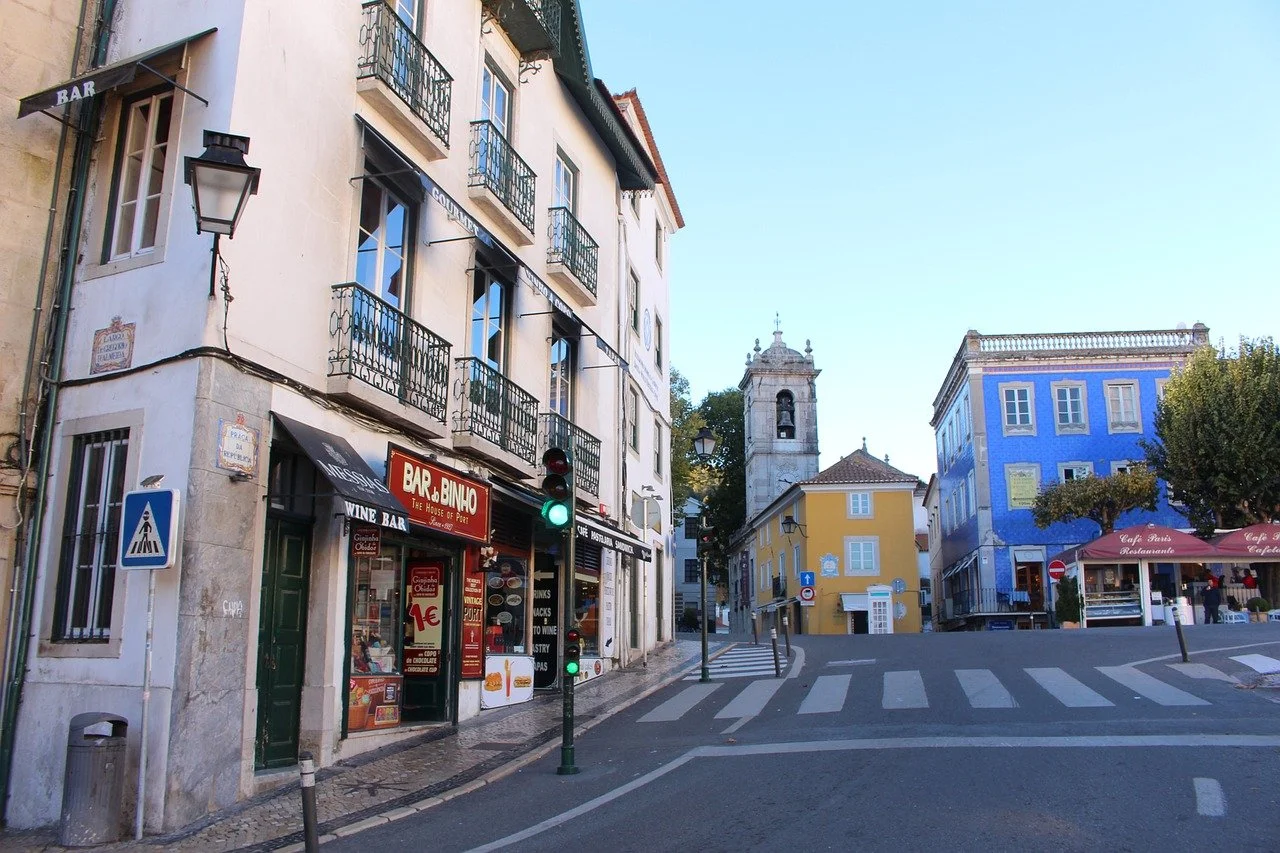 Colorful houses lining a narrow street in Sintra town with traditional Portuguese architecture