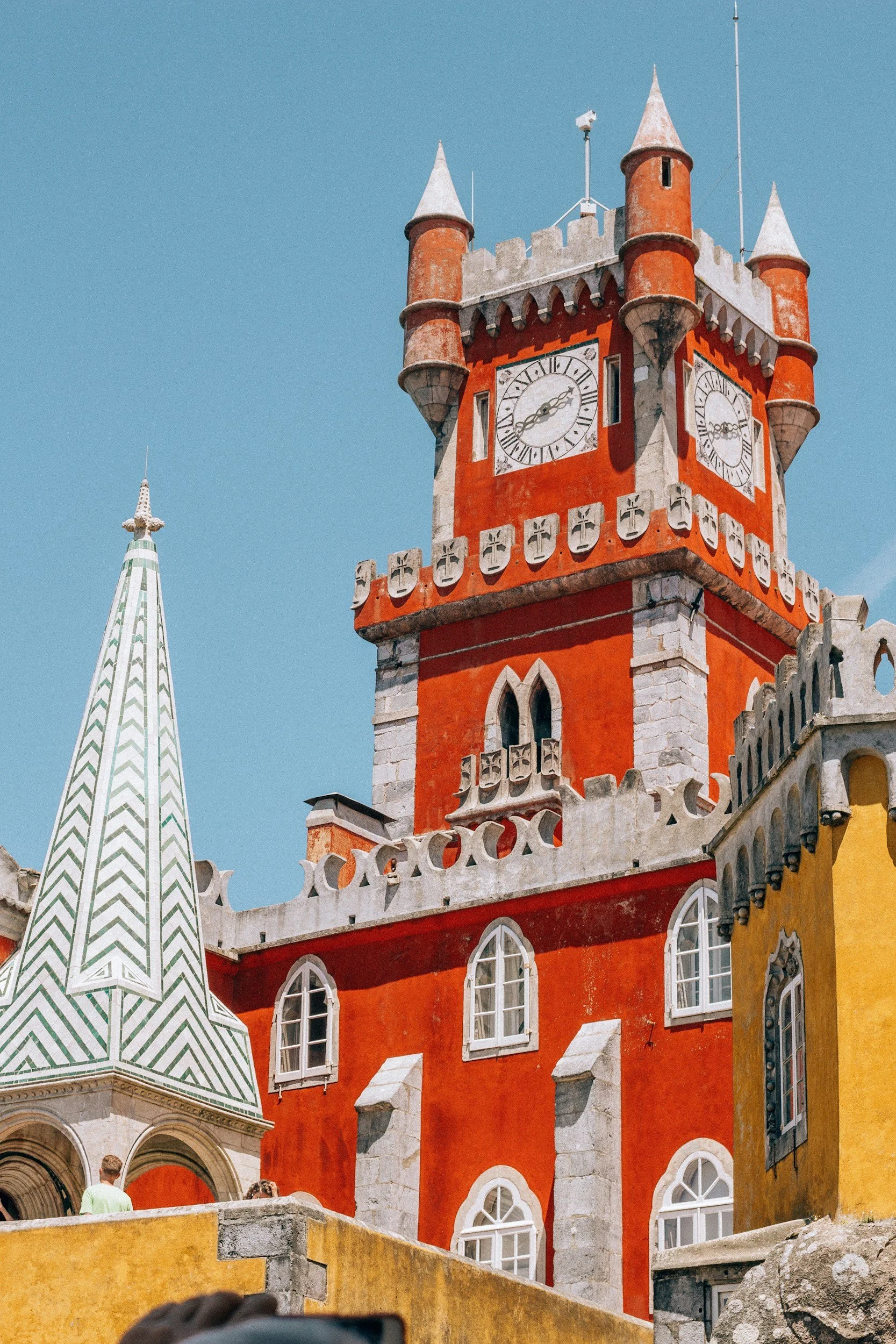 Colorful red and yellow towers of Pena Palace against the sky