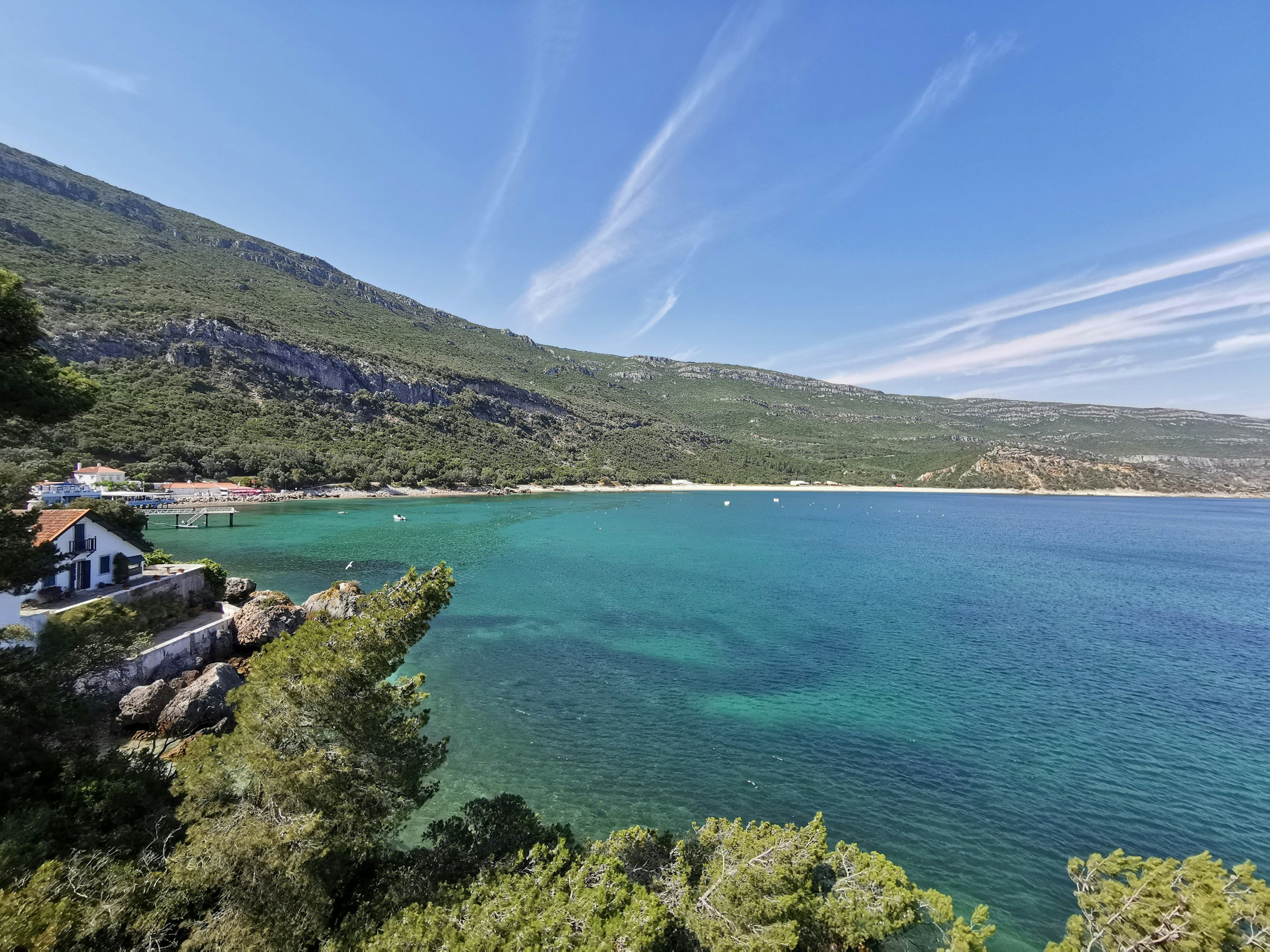 Green mountains meeting the coastline in Arrábida Natural Park