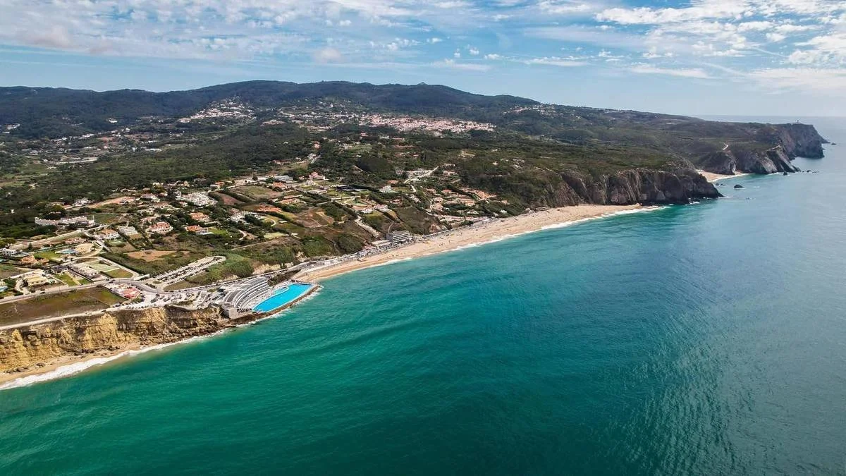 praia-grande-sintra-aerial-coastline-ocean-pool-surf-beach-lisbon.webp