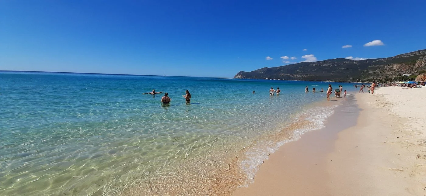 praia-da-figueirinha-swimmers-calm-water-arrabida-portugal.webp