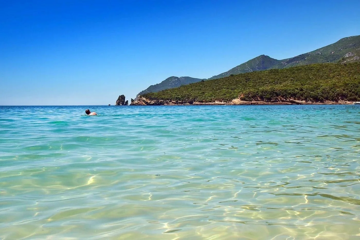 praia-de-galapinhos-clear-turquoise-water-arrabida-portugal.webp