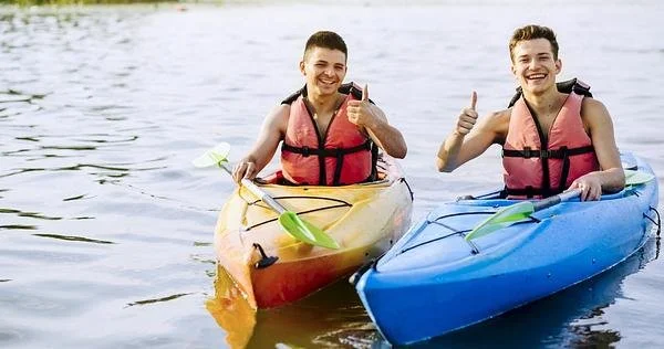 Kayaking on Caniçada Reservoir, Northern Portugal: Two People in Paddling and Giving a Thumbs Up.