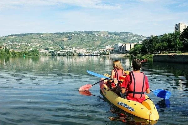 Kayaking & Vineyards Adventure in Douro Valley from Porto: Two People Paddling Along the Douro River