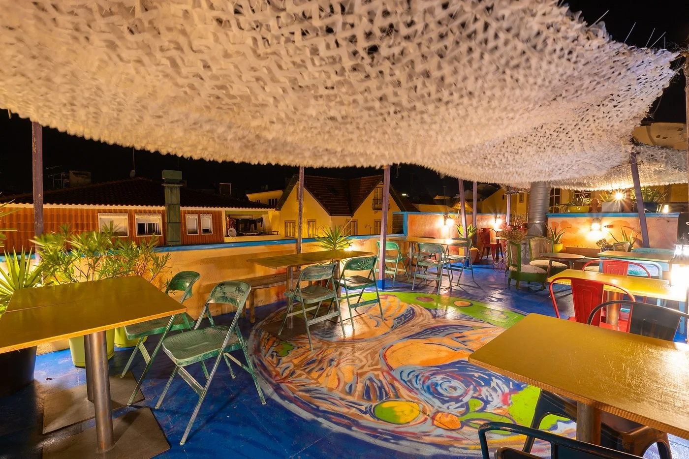 The rooftop patio of House of Wonder Café offers a warm and artsy spot to relax while enjoying views of Cascais.