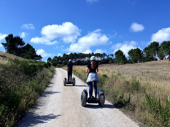 Visitors exploring the scenic paths of Quinta do Pisão, a 380-hectare nature park, on a fun and eco-friendly Segway.