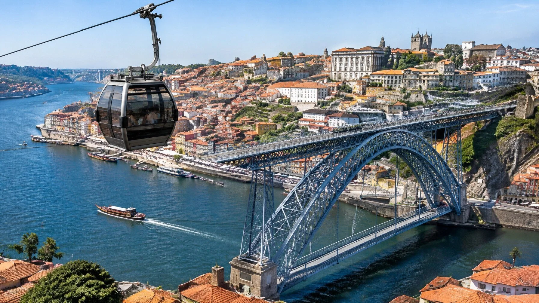 Gaia cable car cabin crossing above the Douro River with the Dom Luis I Bridge and Porto behind it