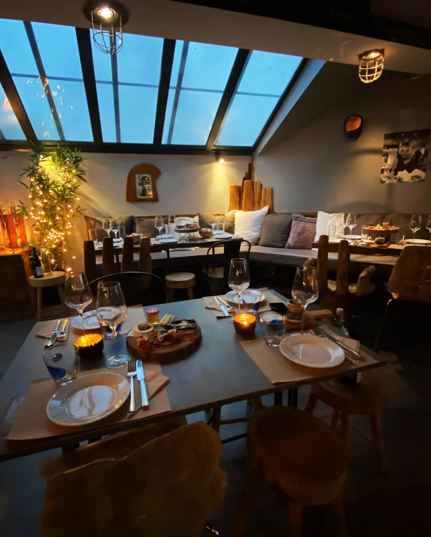 The cozy interior of Bubbles and Bites, a small and intimate Portuguese restaurant, features charming decor that enhances the dining experience, making it the perfect spot to savor traditional Portuguese cuisine with a modern twist.