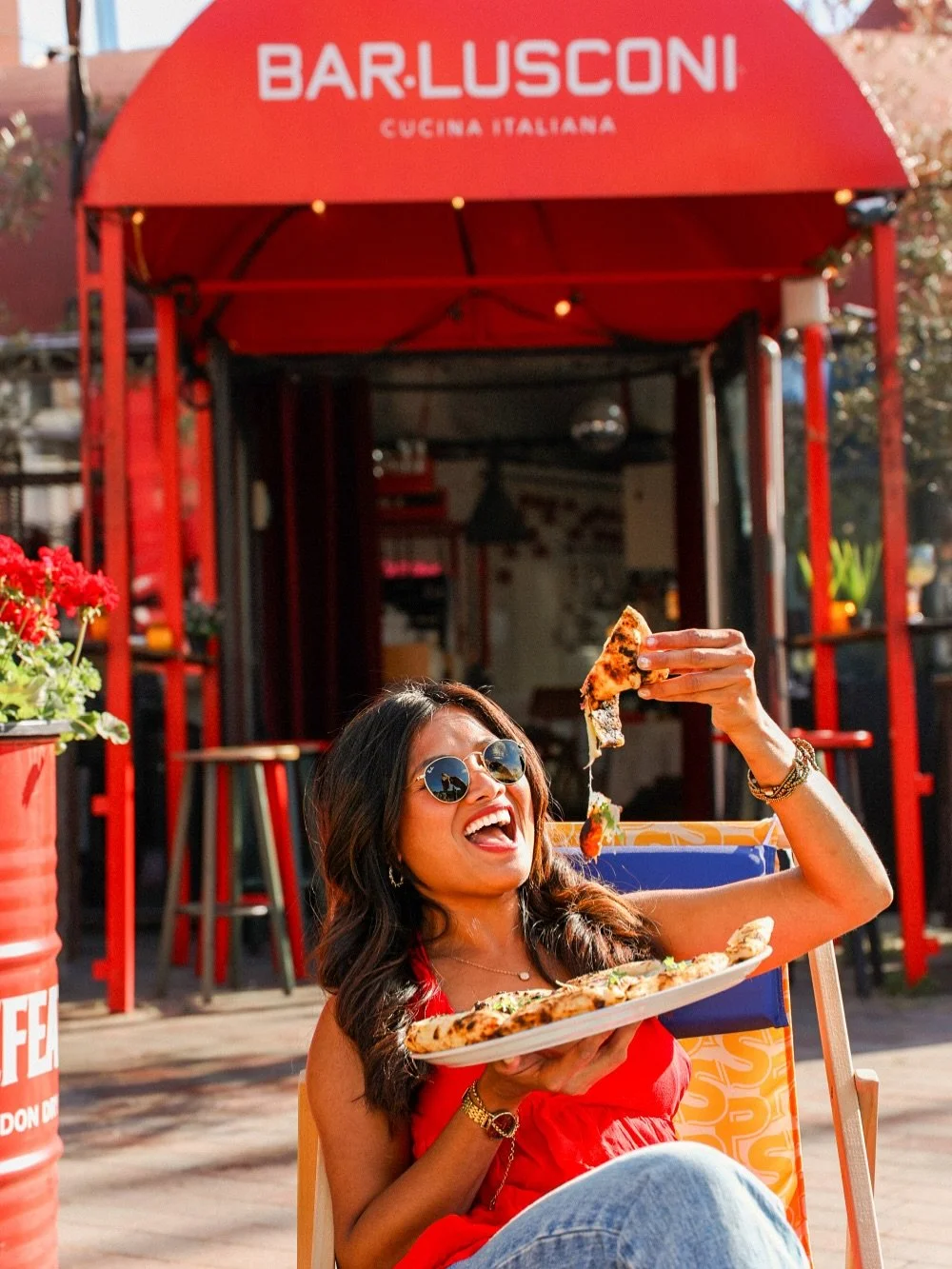 ⚠️ Warning: Our bellissima @meilan.manginsela may cause sudden pizza cravings 🍕☀️⁣
Sun out, shades on, pizza in hand, living la dolce vita like a true Napolitana (in de Baarsjes). ⁣
⁣
Because when you&rsquo;re at BAR.LUSCONI, you&rsquo;re not just e
