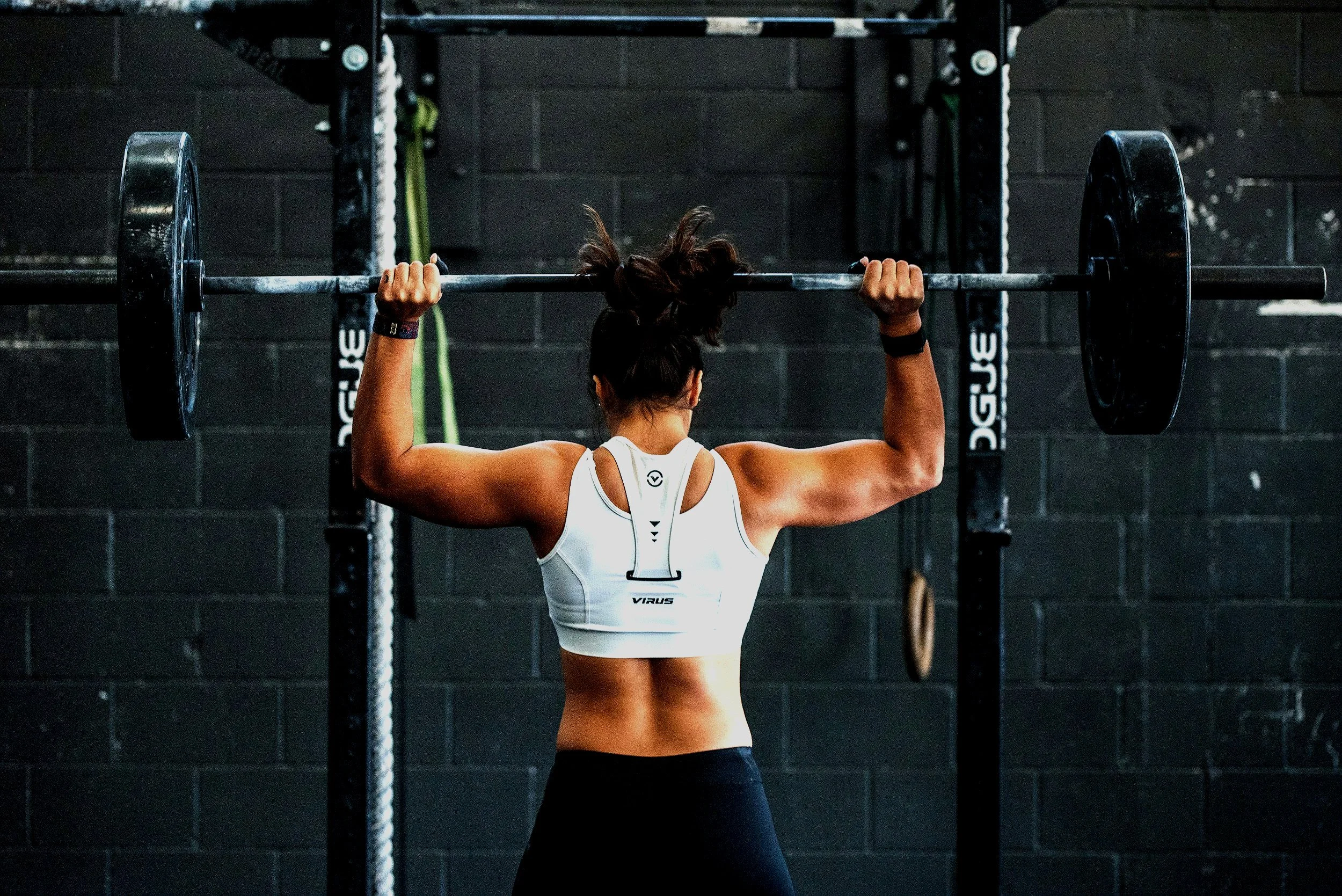 girl strong barbell power