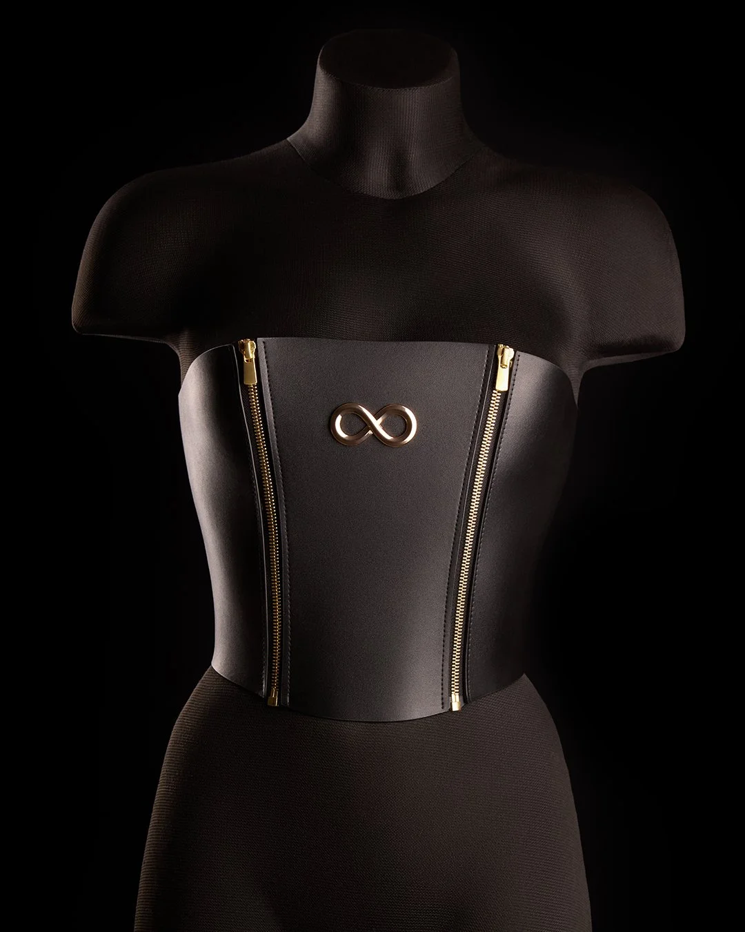 No stretch. No compromise. The Sophia Corset holds its shape &mdash; and the room. Precision-cut vegan leather, suede lining, gold hardware. Built to frame you, not soften you.